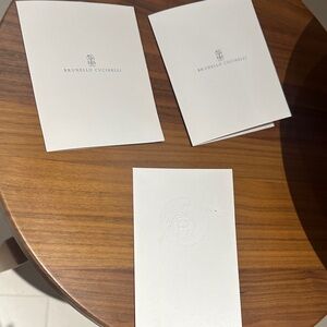 Brunello Cucinelli and Hermes receipt set.